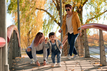 Happy LGBT family having fun in park
