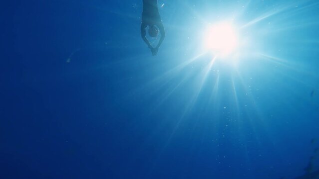 Diving Underwater in the ocean With Long Fins and mask 