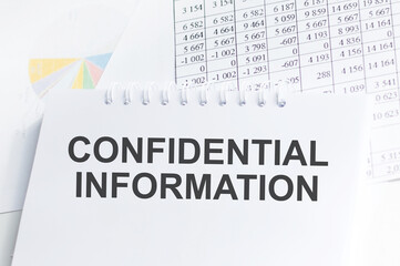 Business concept. Notebook with text confidential information in the white background