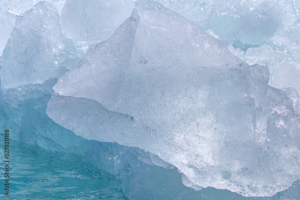 Wall mural a close-up of the layered surface of a blue glacier - knud rasmussen glacier near kulusuk - greenlan
