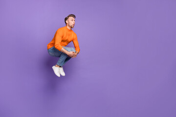 Fototapeta na wymiar Full photo of good mood amazed excited man have fun jumping in pool enjoy summer holiday isolated on violet color background