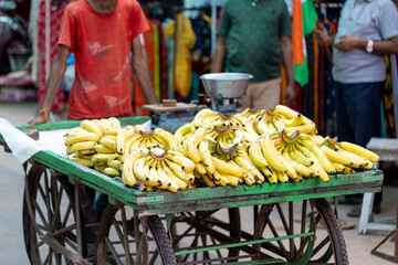 Man pushing cart with bananas. Street vending in Pushkar, Rajasthan (India). - 527820508