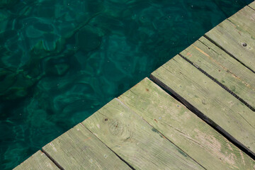 wooden pier on a background of turquoise water