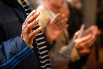 Faithful praying in Sainte Genevieve's cathedral, Nanterre.