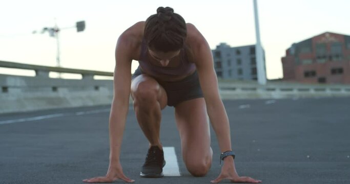 Runner, athlete or sports woman running and sprinting outdoors in a city training for a sprint competition. Active, fit and athletic young female doing her workout or exercise in an urban town