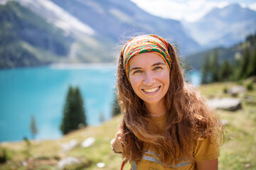Tourist in the mountains in Switzerland on Lake Oeschinensee