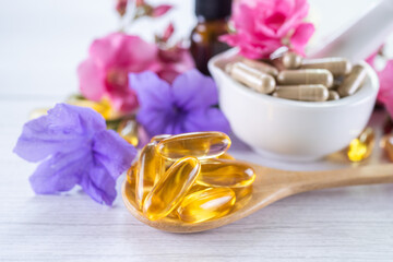 Alternative medicine herbal organic capsule with vitamin E omega 3 fish oil, mineral, drug with herbs leaf natural supplements for healthy good life.