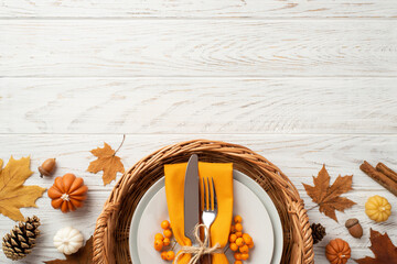 Thanksgiving day concept. Top view photo of rattan tray with plate cutlery napkin rowan maple...