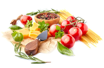 Fresh tomatoes with spaghetti, basil leaves, rosemary,  pepper and cheese  isolated on white background. Ripe tomatoes with spices.