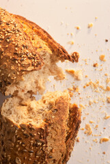 Bitten and cut bread with crumbs around