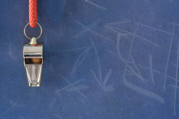 Whistle of soccer referee or trainer and soccer tactics scribble on blue background. Great soccer...