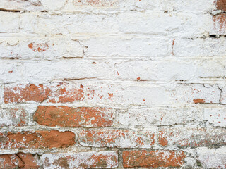 Red brick wall with plaster