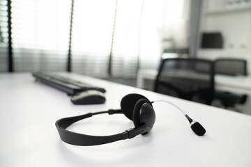 Close up image of headphones for competent online working. Customer service operator equipments.