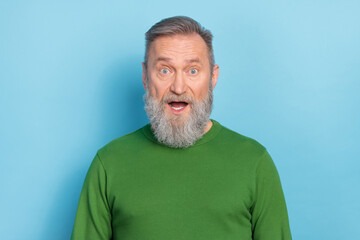 Photo of astonished matured aged man open mouth incredible bargain wear sweater isolated blue color background
