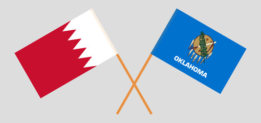 Crossed flags of Bahrain and The State of Oklahoma. Official colors. Correct proportion