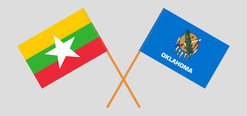 Crossed flags of Myanmar and The State of Oklahoma. Official colors. Correct proportion