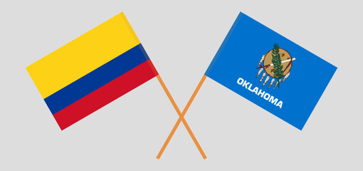 Crossed flags of Colombia and The State of Oklahoma. Official colors. Correct proportion