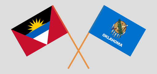 Crossed flags of Antigua and Barbuda and The State of Oklahoma. Official colors. Correct proportion