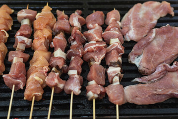 Raw meat grilling on fire