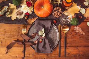 Served table with autumn decor. Thanksgiving dinner table setting top view