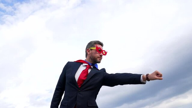 heroic super man flying with raised hand in sky, superhero