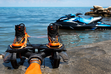 Shoes for a flyboard on the seashore.