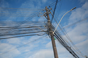 salvador, bahia, brazil - august, 25, 2022: Electric network wiring and TV network cables on a pole...