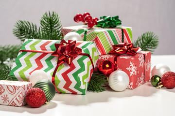 Holiday greeting card. Christmas gift boxes on white background. New year card. Colorful background.