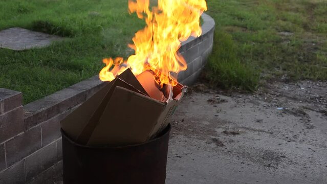 Dumpster Fire Large Orange Flames Lick Out of Trashcan Fire