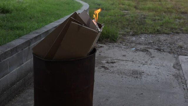 Dumpster Fire Large Orange Flames Lick Out of Trashcan Fire