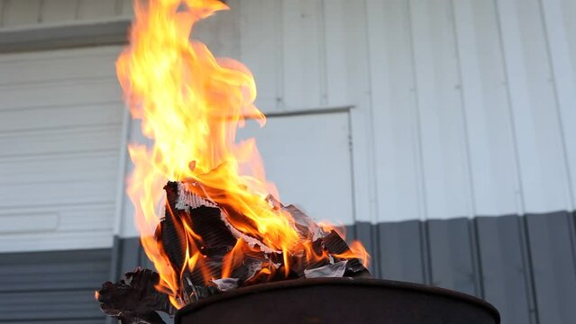 Dumpster Fire Large Orange Flames Lick Out of Trashcan Fire