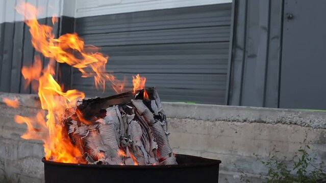 Dumpster Fire Large Orange Flames Lick Out of Trashcan Fire