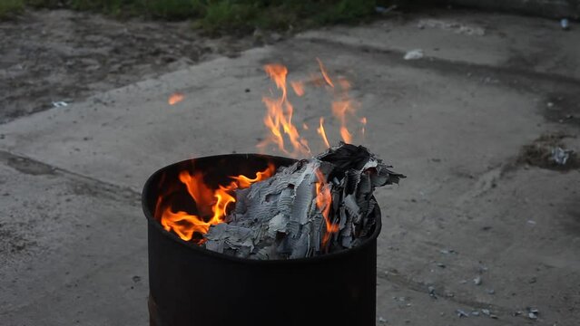 Dumpster Fire Large Orange Flames Lick Out of Trashcan Fire