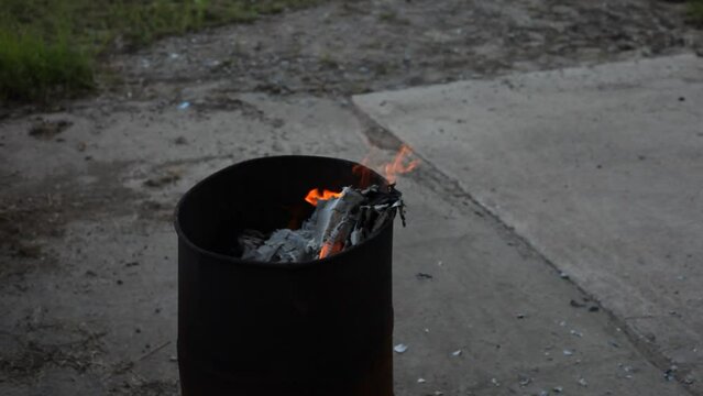 Dumpster Fire Large Orange Flames Lick Out of Trashcan Fire