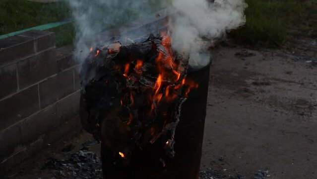 Dumpster Fire Large Orange Flames Lick Out of Trashcan Fire