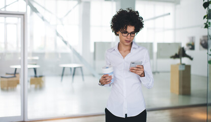 Millennial business woman use smartphone in office