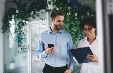 Millenial business man and woman working in office