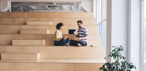 Man and woman resting in coworking office space