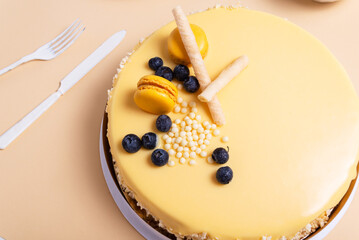 Passion fruit mousse cake on beige background