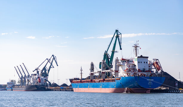 Gdansk, Poland - August 14, 2022: A picture of a cargo ship and a bulk carrier in the Gdansk Shipyard.