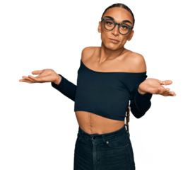 Hispanic transgender man wearing make up and long hair wearing women clothes clueless and confused expression with arms and hands raised. doubt concept.
