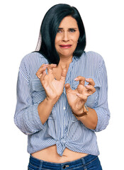 Young caucasian woman wearing casual clothes disgusted expression, displeased and fearful doing disgust face because aversion reaction.