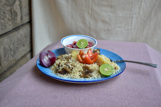 A plate of Kenyan pilau. Shot at dinner's perspective. 
