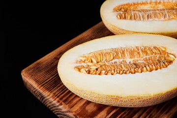 Melon halves on a wooden board