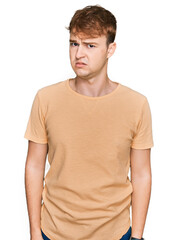 Young caucasian man wearing casual clothes skeptic and nervous, frowning upset because of problem....
