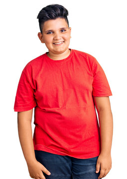 Little boy kid wearing casual clothes looking positive and happy standing and smiling with a confident smile showing teeth
