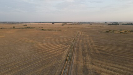 Fototapeta na wymiar Aerial top view photo from flying drone of a land with down fields in countryside.