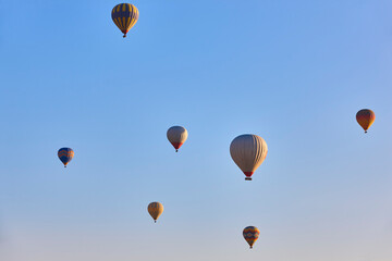 Spectacular balloons flying at sunrise in Goreme. Turism Cappadocia, Turkey