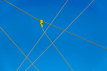 Iron cables over blue sky