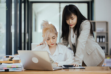 Group of young Asian business woman teamwork and presenting new projects in the office.